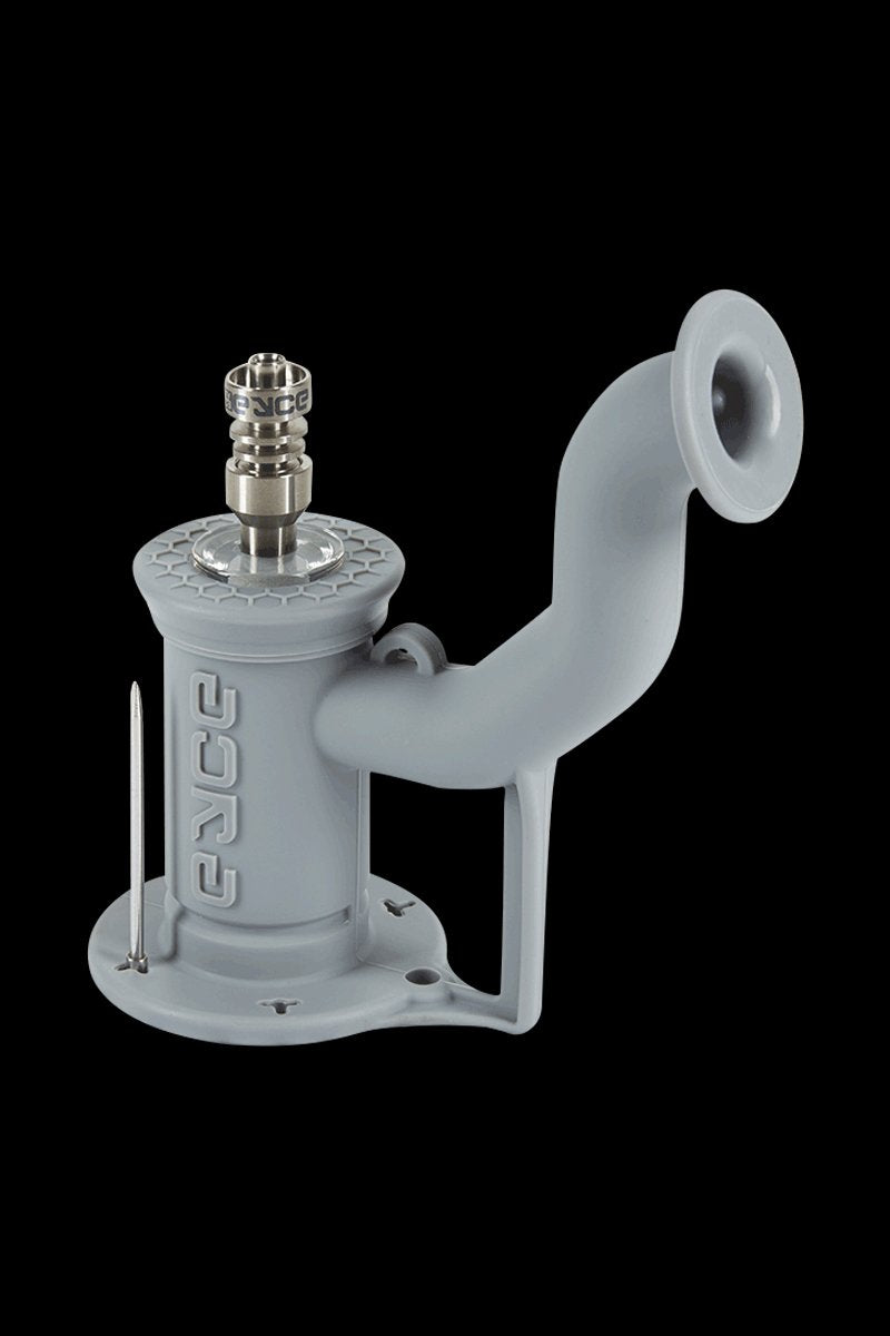 Angled front view of the coral reef EYCE Rig II Silicone Bong showing its matte curved mouthpiece, embossed body, and metal nail.