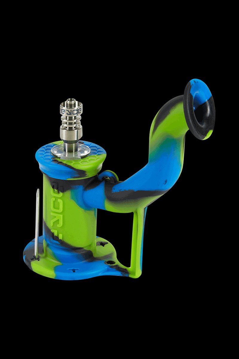 Angled front view of an Arcadia Camo EYCE Rig II Silicone Bong in blue, green, and black with a metal bowl against black background