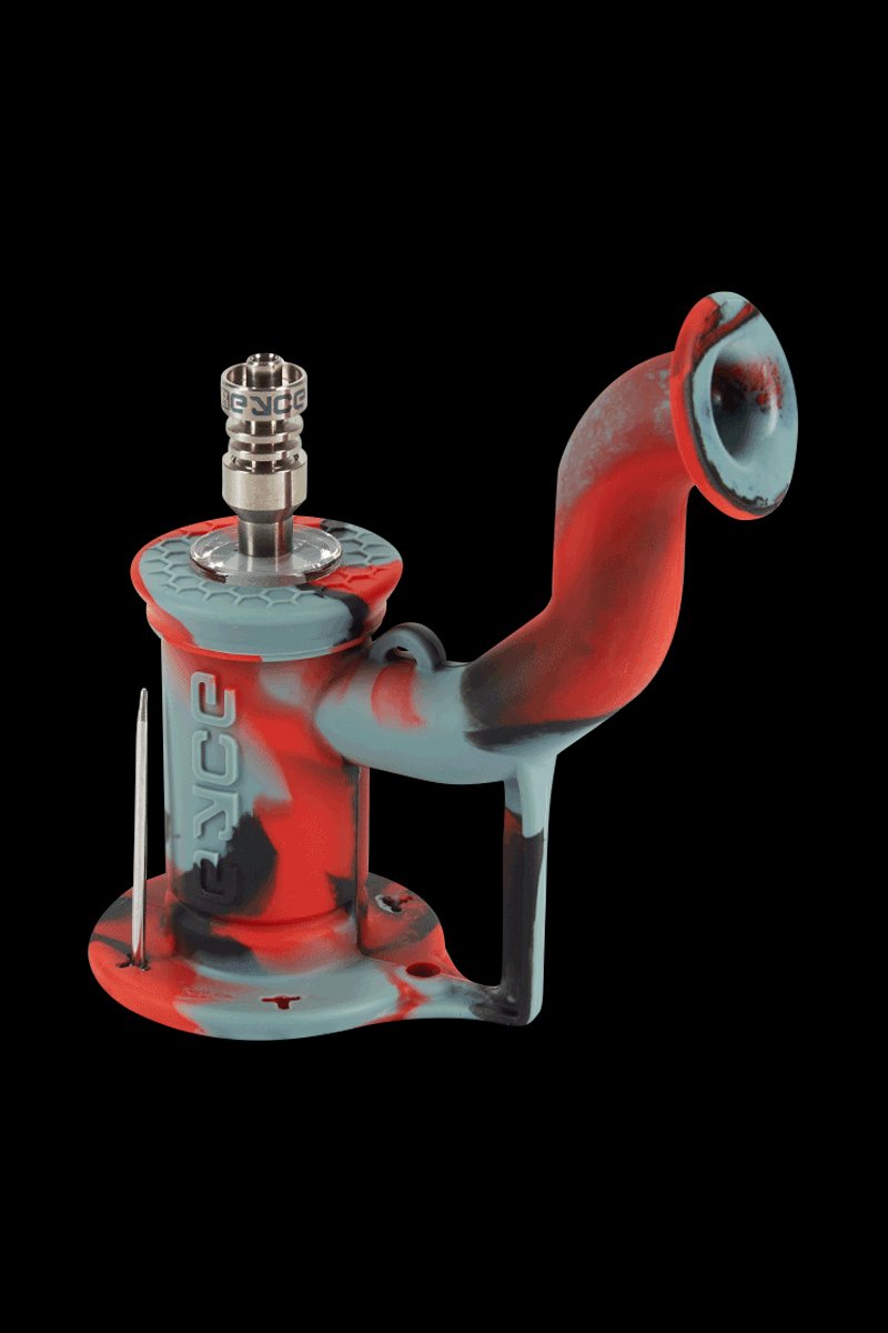 Angled close-up of the EYCE Rig II Silicone Bong in dark green–appearing red and teal marbled silicone against a black background.