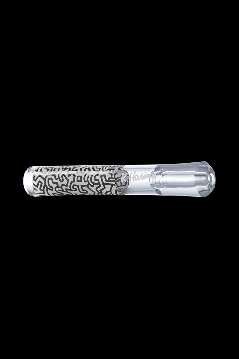 A straight-on view of the K.Haring Taster Chillum Pipe, showcasing its simple, handheld design against a dark background.