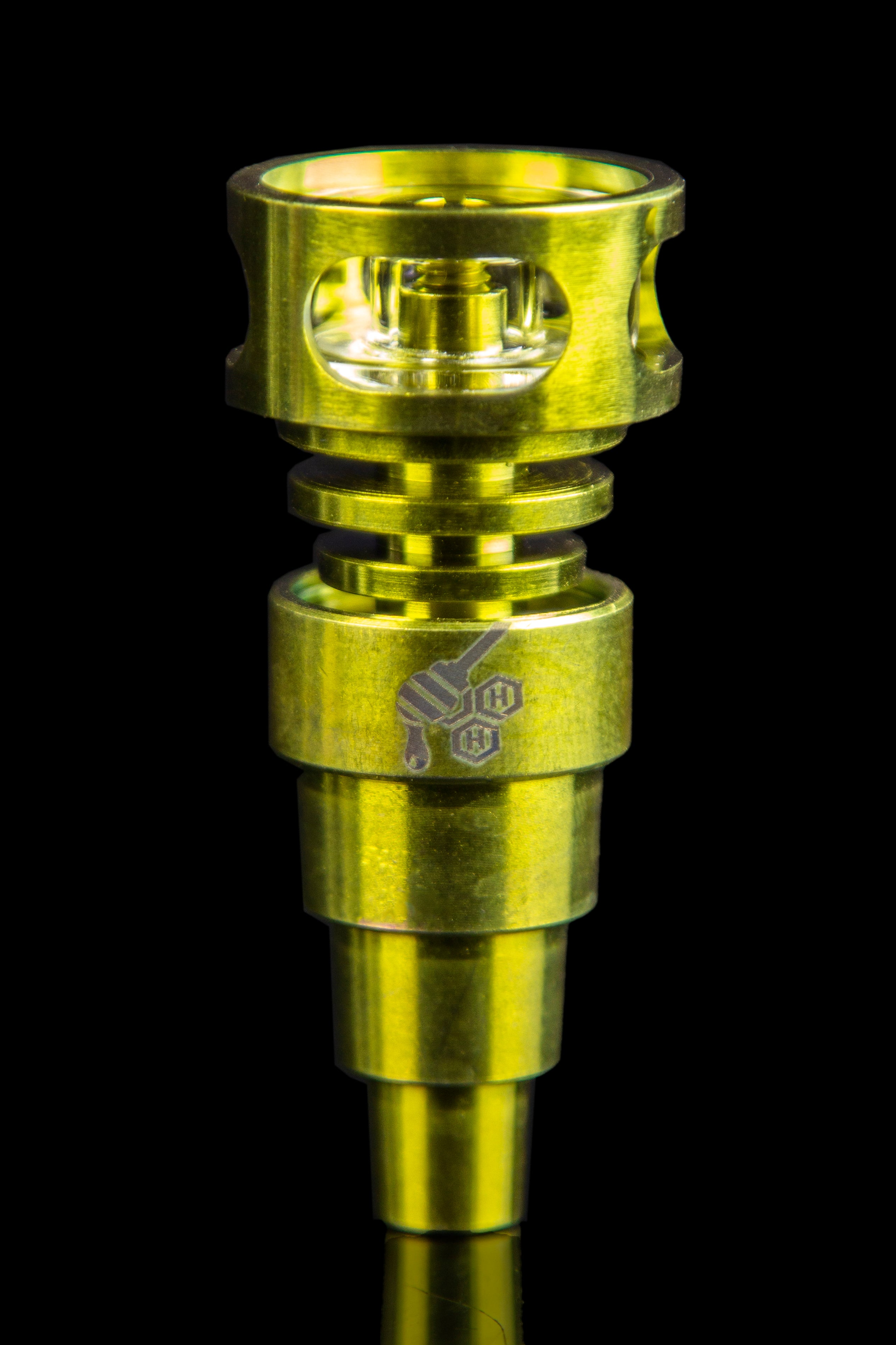 Gold-toned oil rig perc component with etched logo against a black background.