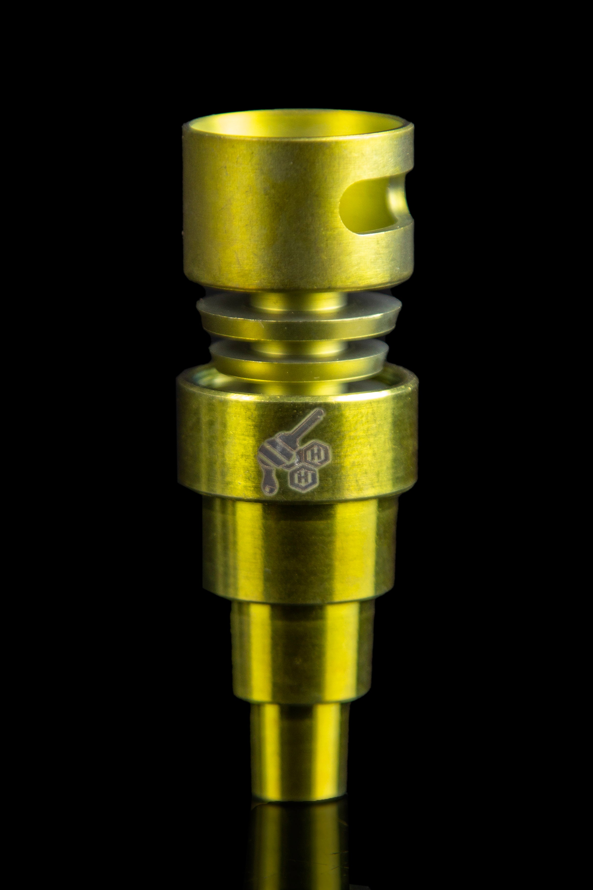 Gold-colored dab nail with etched logo, used for vaporizing cannabis concentrates."