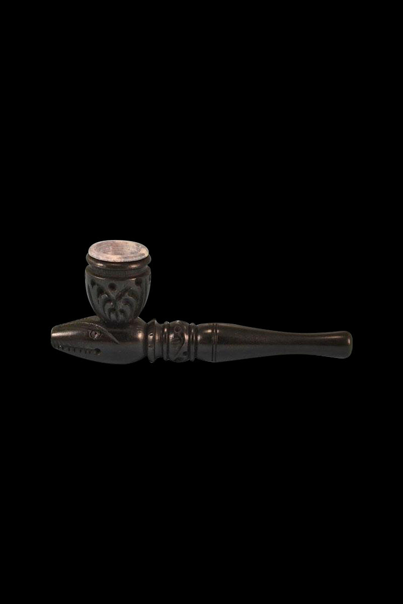 A detailed side view of the Carved Wood Tobacco Pipe showcasing its intricate wood grain and curved bowl.