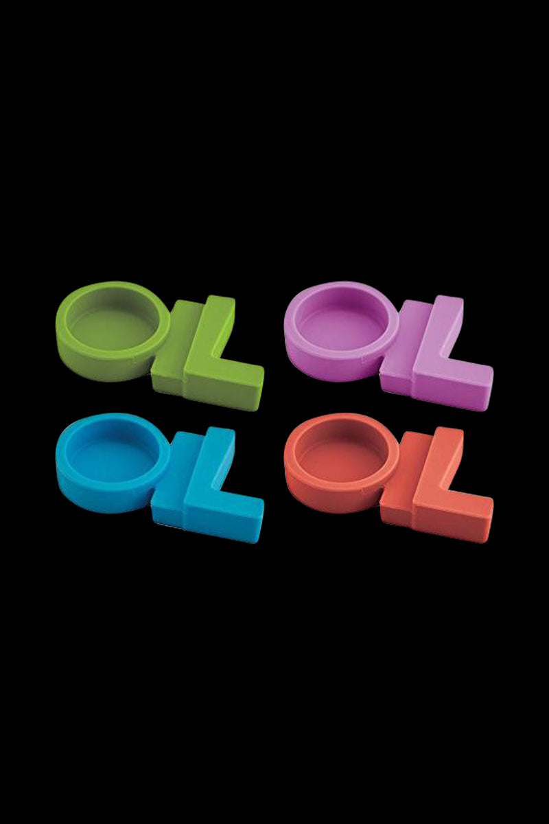 Top-down view of four colorful NoGoo - 420 Oil Station pieces (green, pink, blue, orange) arranged in a loose square on black.