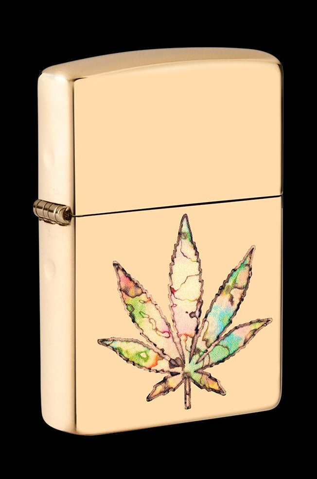 Gold Zippo lighter with a colorful cannabis leaf design.