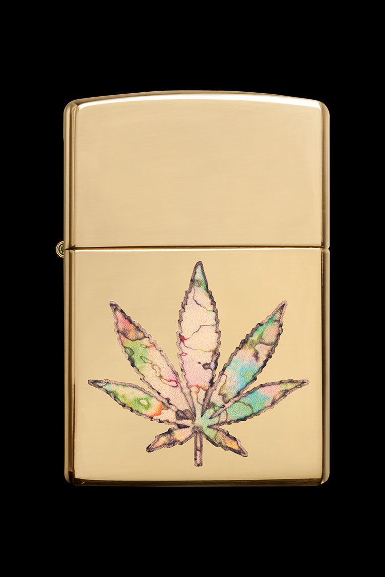 Gold Zippo lighter with a watercolor-style cannabis leaf design.