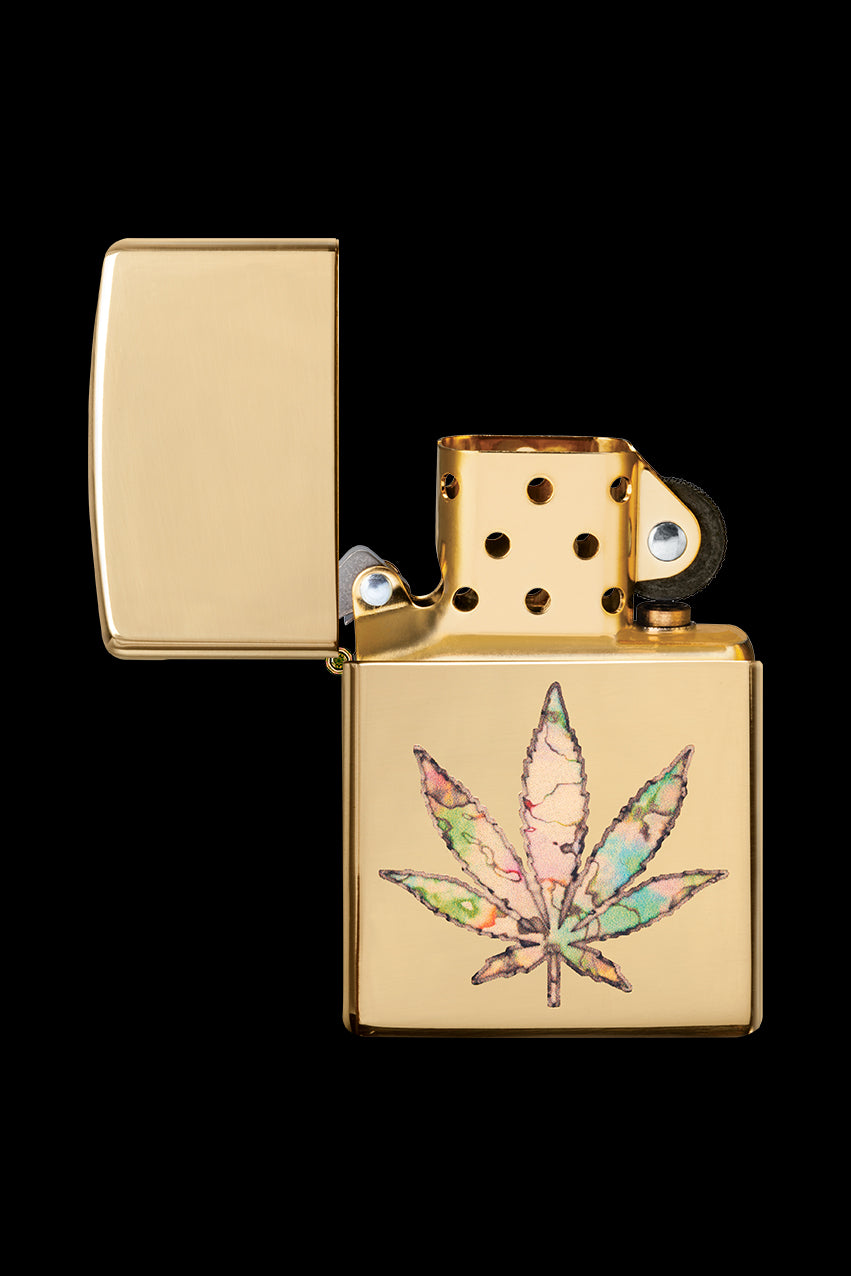 Gold Zippo lighter with a colorful cannabis leaf design.