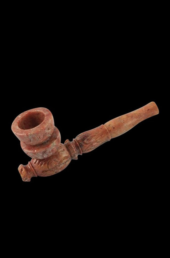 A close-up, angled view of the Marble Stone Pipe, showcasing its textured stone construction.