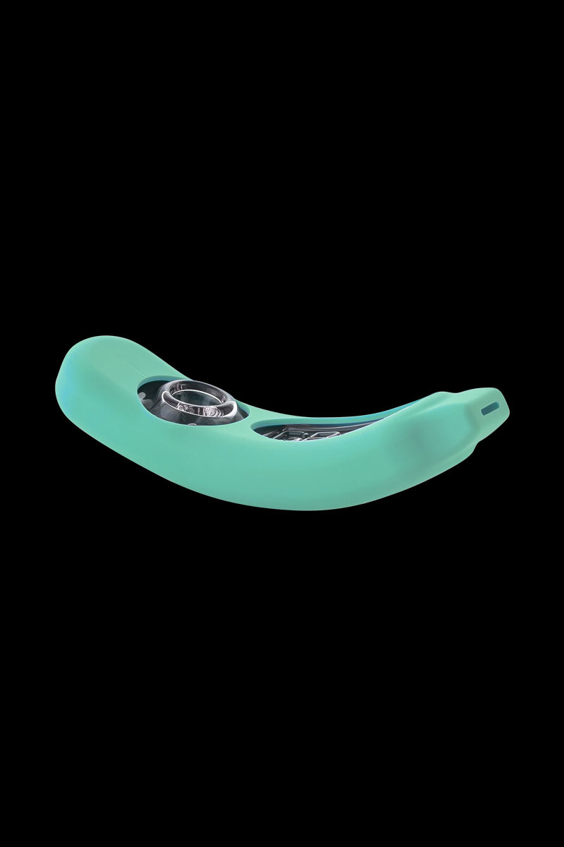 Angled front view of the mint silicone GRAV® Rocker Steamroller with visible glass bowl and curved rocker shape against black.