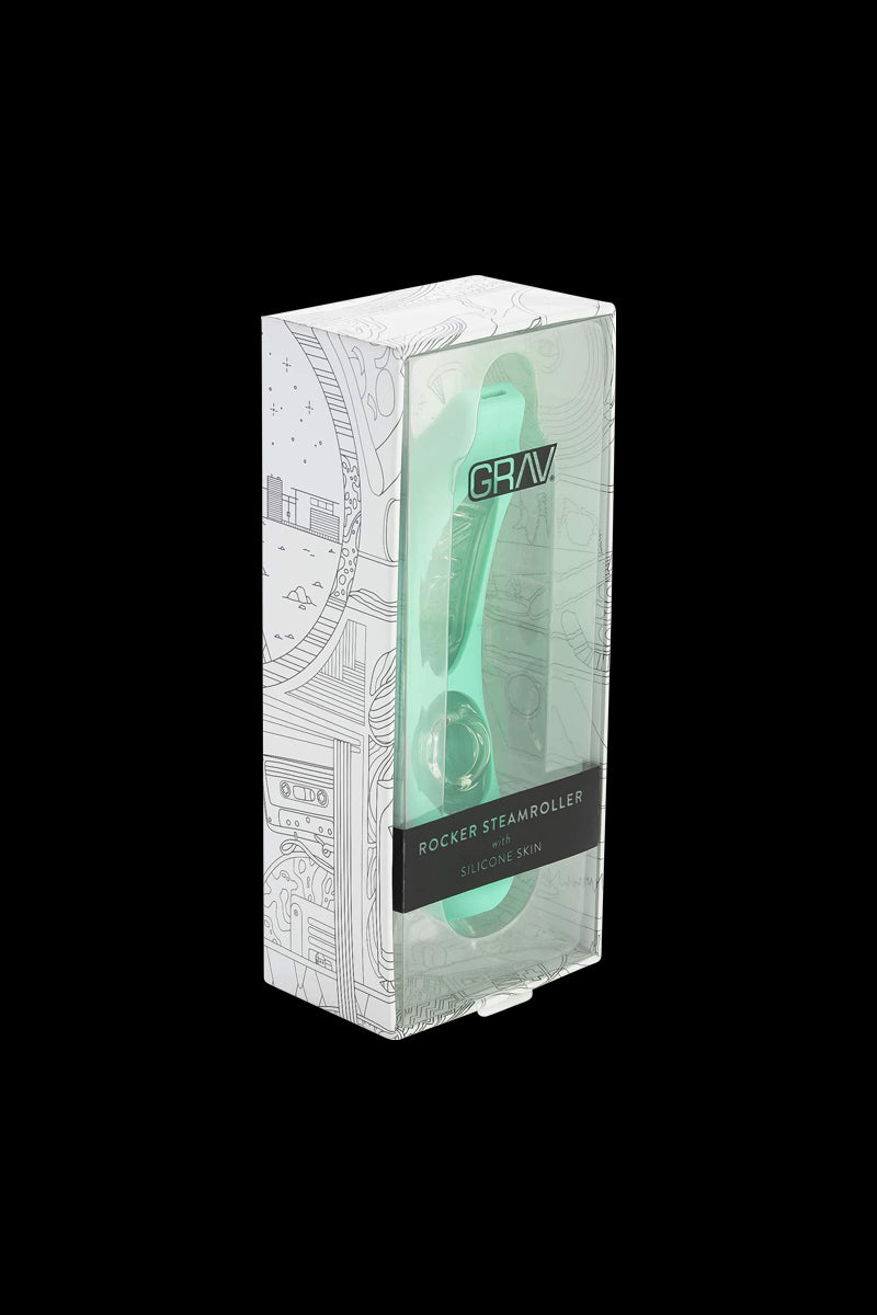 Three-quarter front view of the GRAV® Rocker Steamroller with Silicone Skin in mint green visible through its illustrated white and clear retail box.