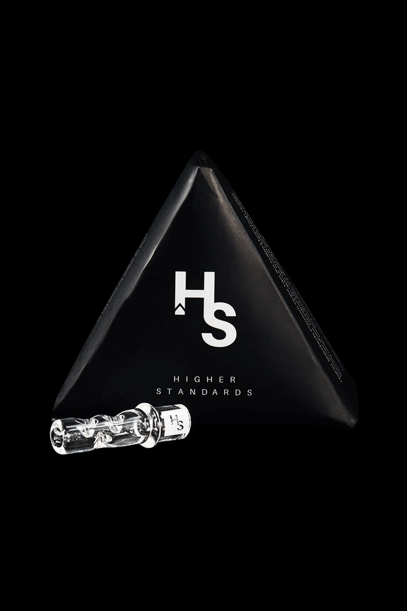 Close-up of cannabis oil cartridges and packaging with the “HS” logo for Higher Standards against a black background.