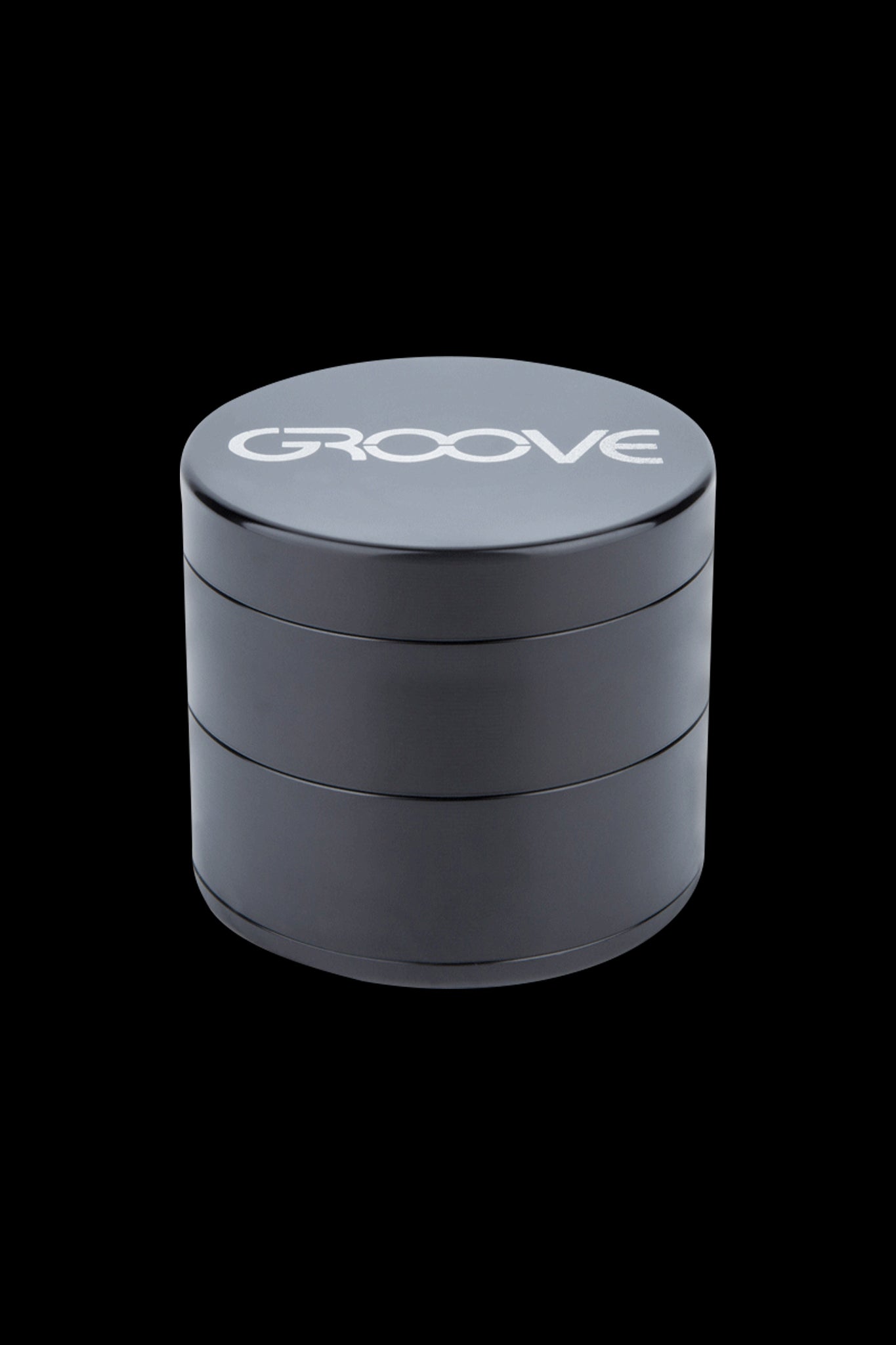 Black four-layer cannabis grinder with "GROOVE" logo on the lid.