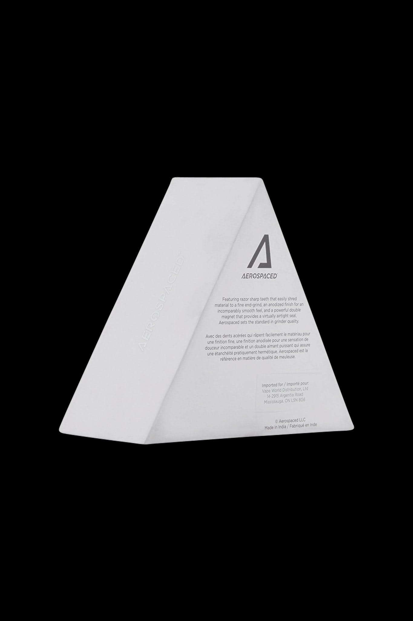 White, triangular cannabis packaging with “AEROSPACED” branding and French/English text.