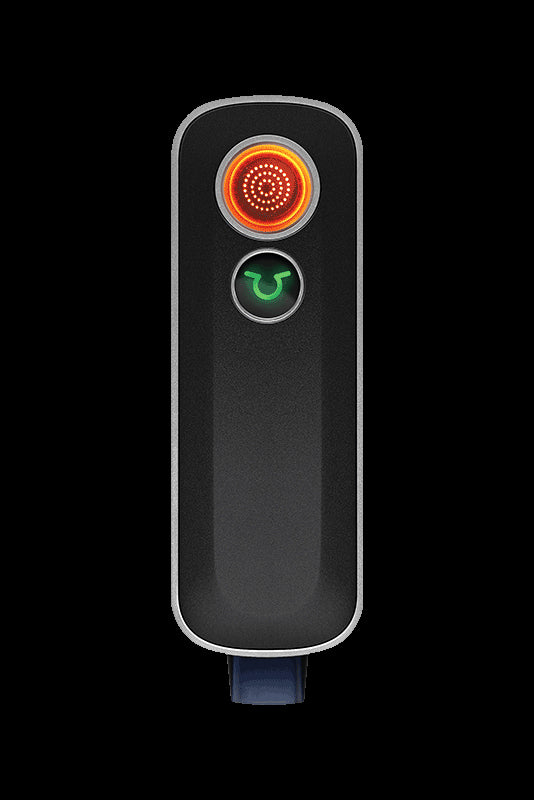 Sleek black cannabis vaporizer pen with illuminated power button and temperature indicator.