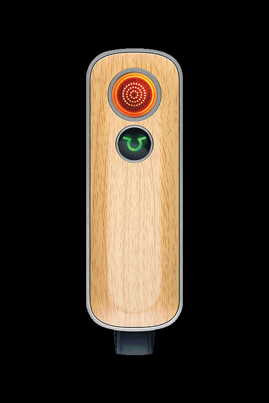 Wooden cannabis vaporizer pen with illuminated controls.
