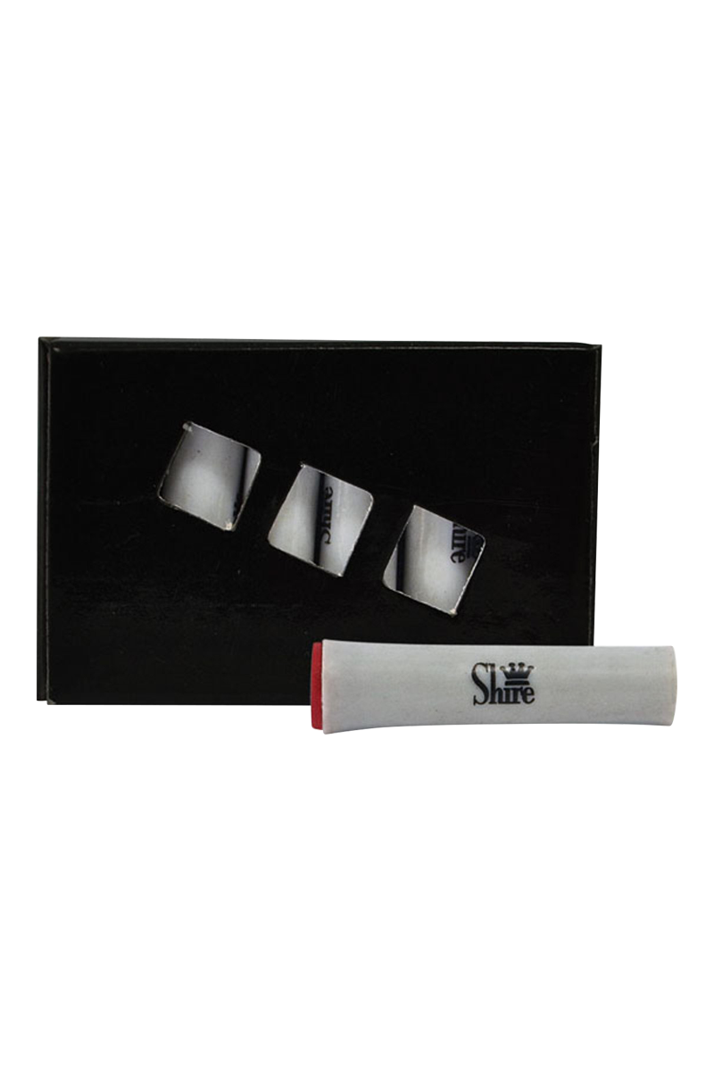 A top-down view of the Pulsar Replacement Charcoal Filters - 6 Pack, neatly arranged in their packaging on a black surface.