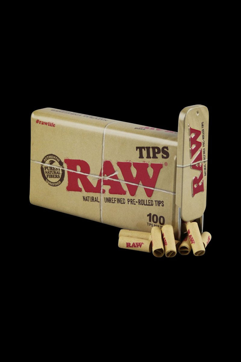 RAW Pre-Rolled Tips are stacked in a close-up, slightly angled view, showcasing the branded packaging and a small pile of the paper tips.