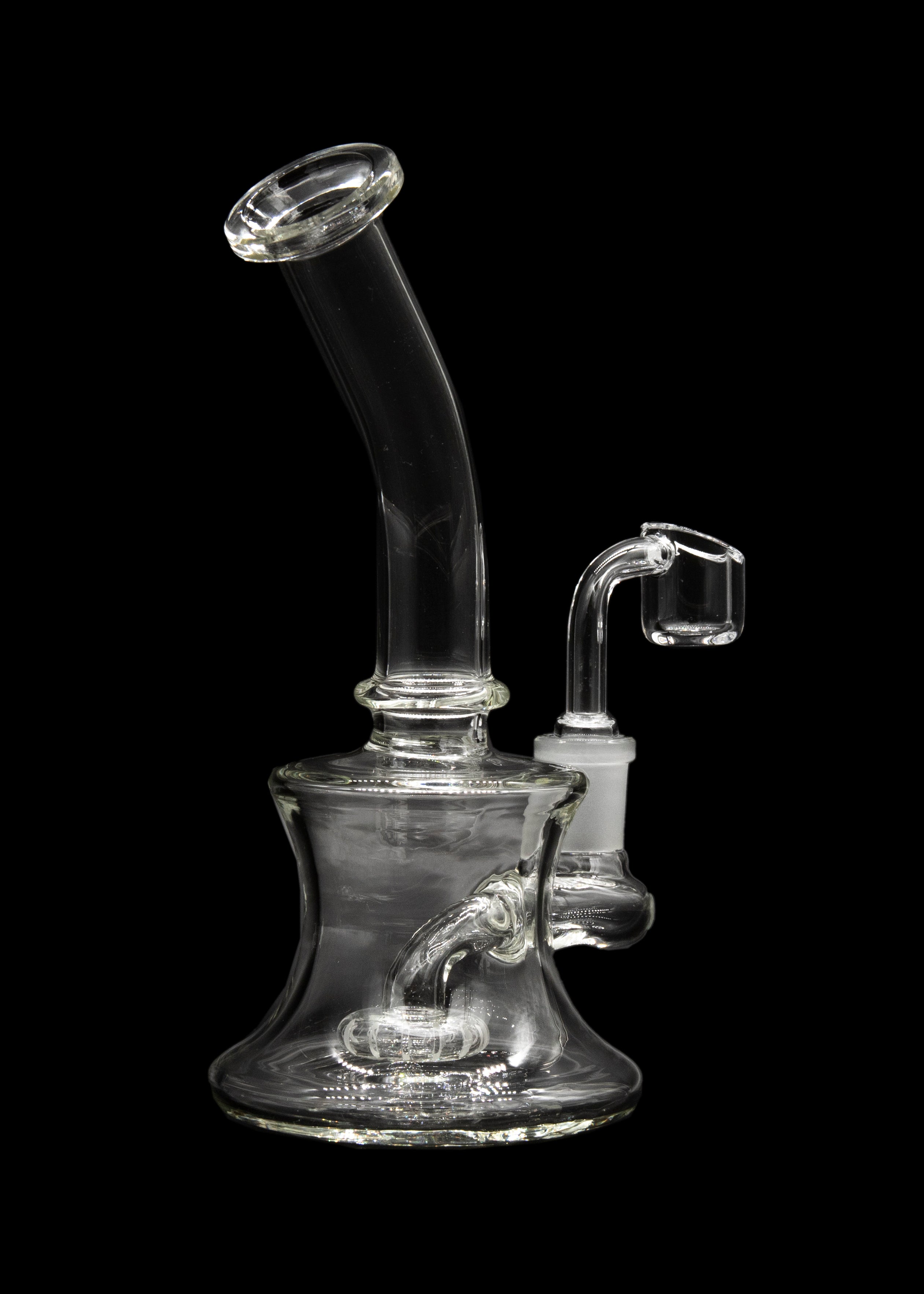 Clear glass dab rig with a quartz banger, isolated on a black background.