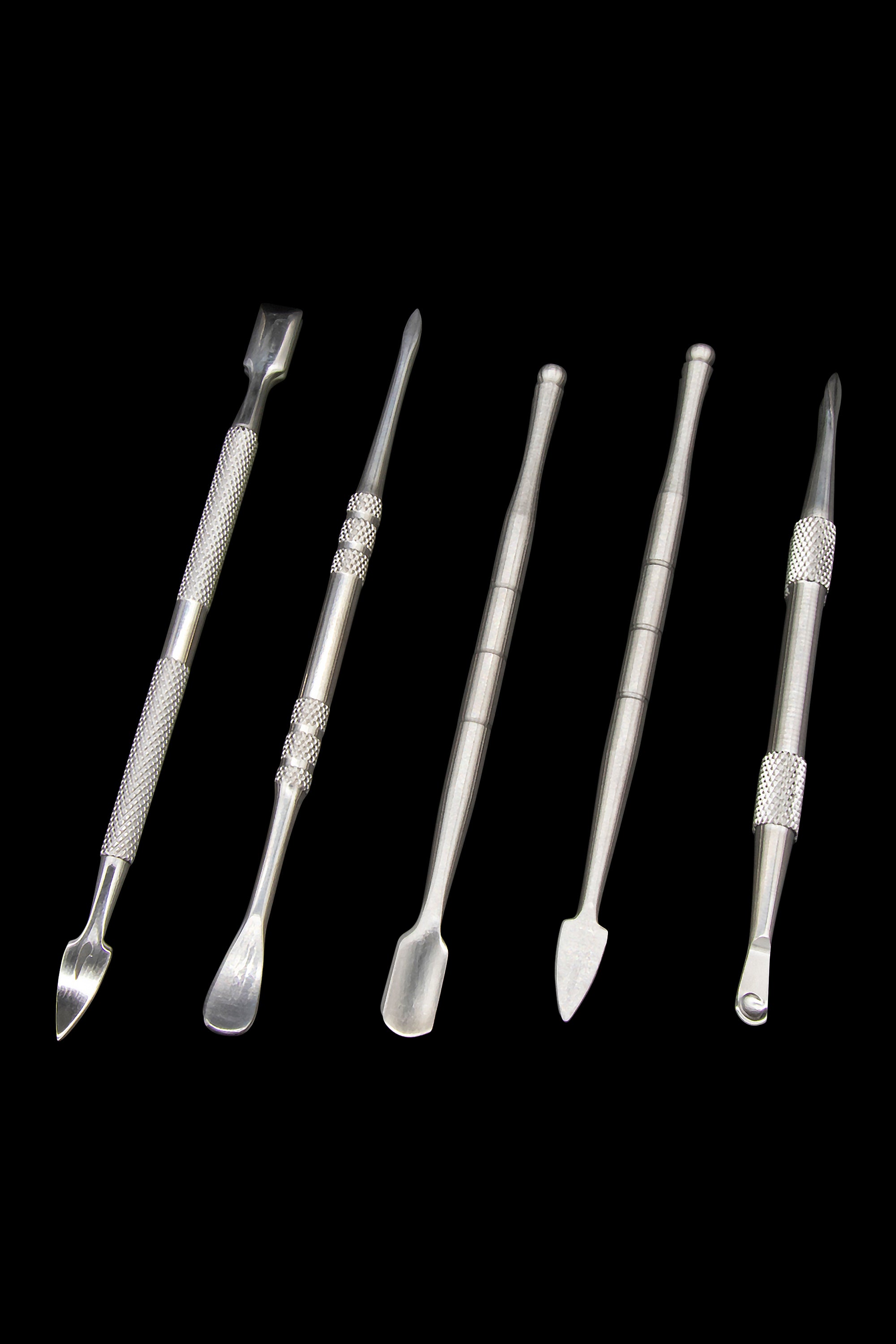 Silver dab tools for cannabis concentrates arranged on a black background.