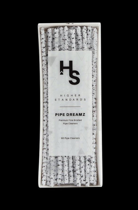 Top-down view of a white box of Higher Standards Pipe Dreamz showing neatly packed gray, fuzzy pipe cleaners and the centered product label.