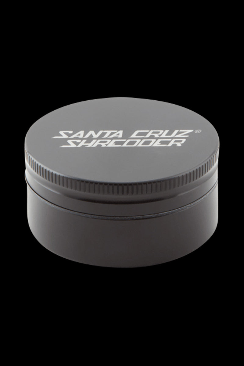 Top-down view of the Santa Cruz Shredder 2-Piece Grinder showing its matte blue circular lid with white logo and ridged edge.