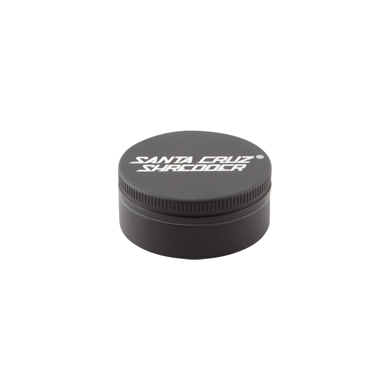 Top-down view of a matte black Santa Cruz Shredder 2-Piece Grinder showing the white logo on the lid and textured rim.