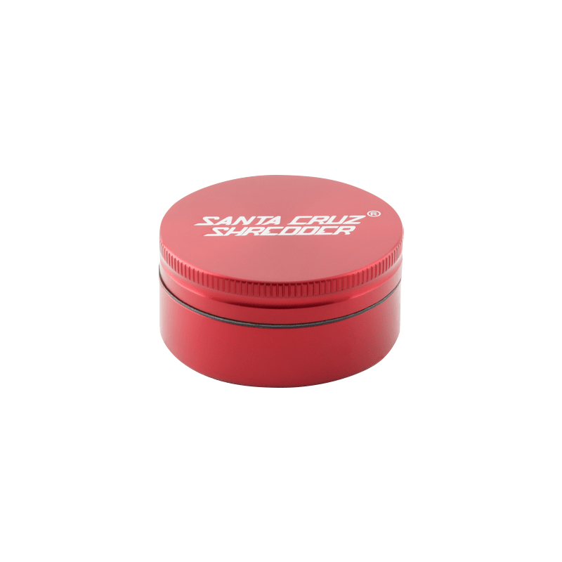 Top-down view of a pink Santa Cruz Shredder 2-Piece Grinder showing the white logo on the threaded lid and a thin black gasket.