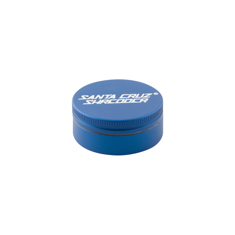 Top-down view of a medium red Santa Cruz Shredder 2-Piece Grinder with white logo text on the lid and subtle side knurling.