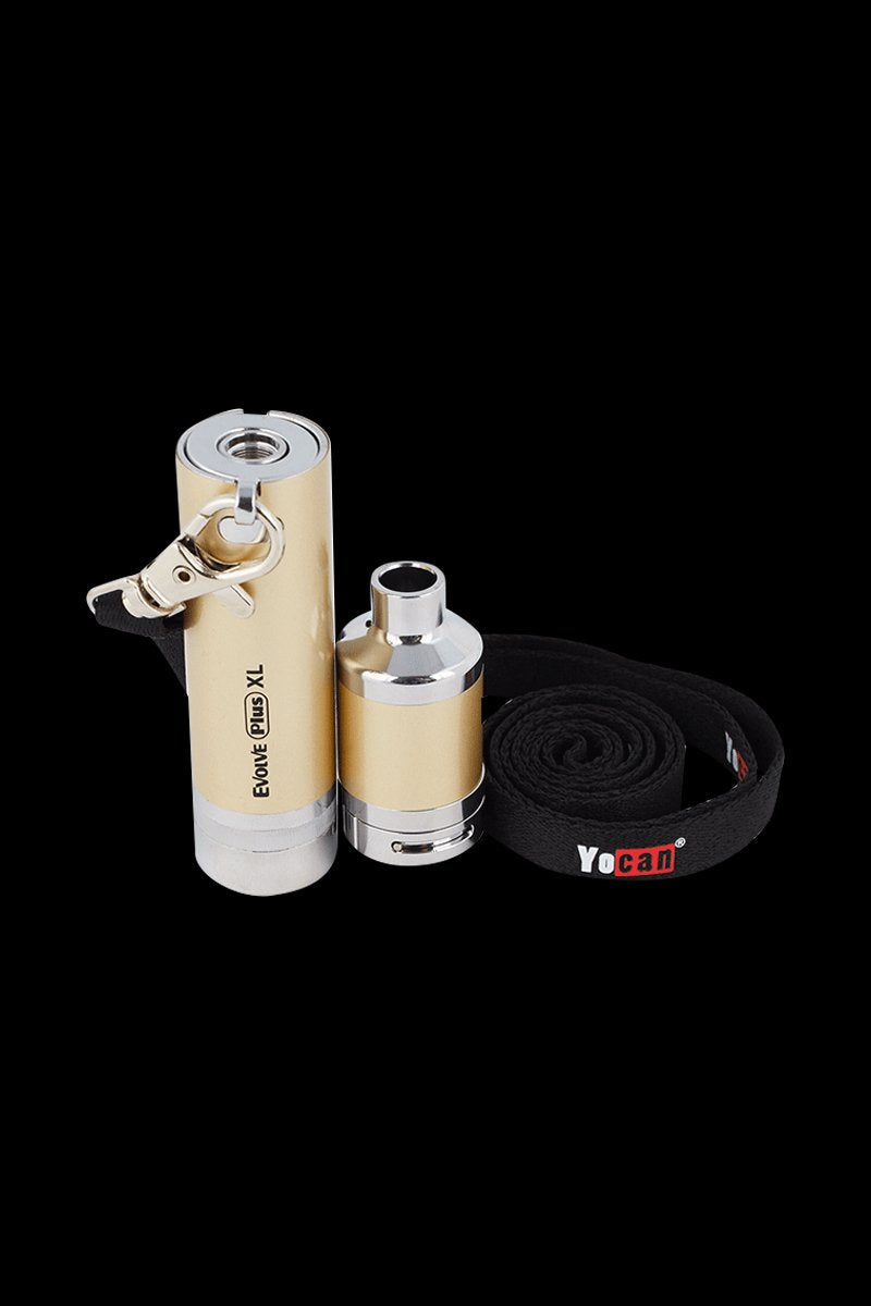 Close-up front view of the gold Yocan Evolve Plus XL Vaporizer with its detached atomizer and coiled black Yocan lanyard on a black background