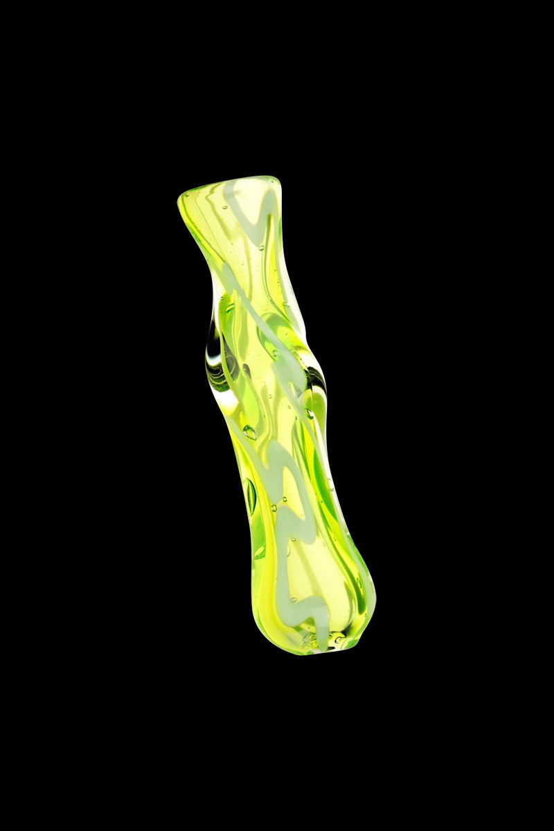 Angled close-up of an acid green Worked Glass Taster Chillum against a black background, showing its twisted, bubble-filled glass surface.