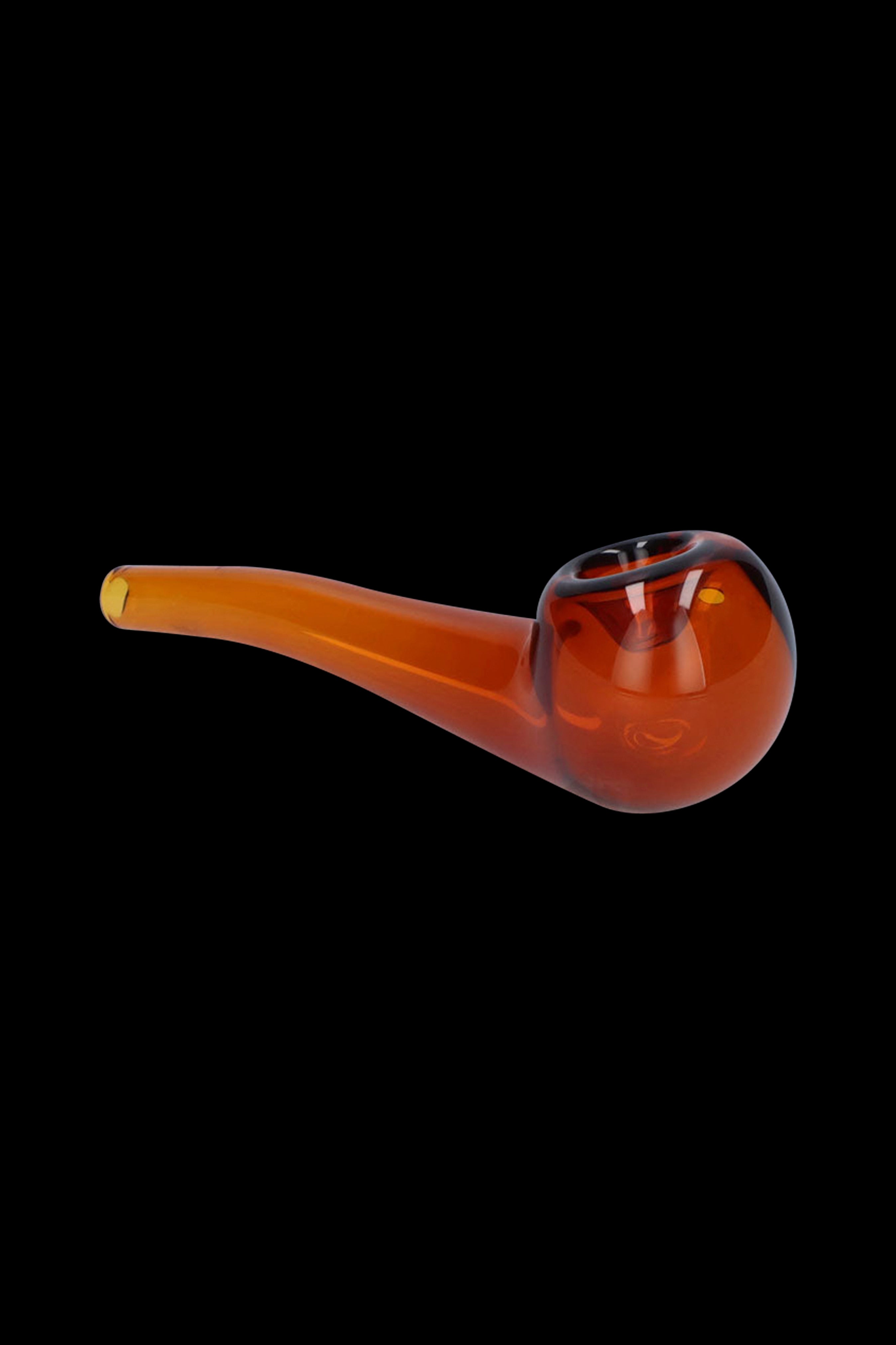 Amber glass pipe for smoking cannabis, isolated on a black background.