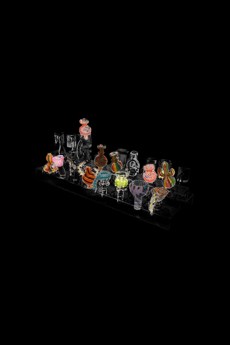 A slightly angled view of the Banger & Bowl Clear Acrylic Display Holder showcasing its clear, tiered design for multiple pieces.