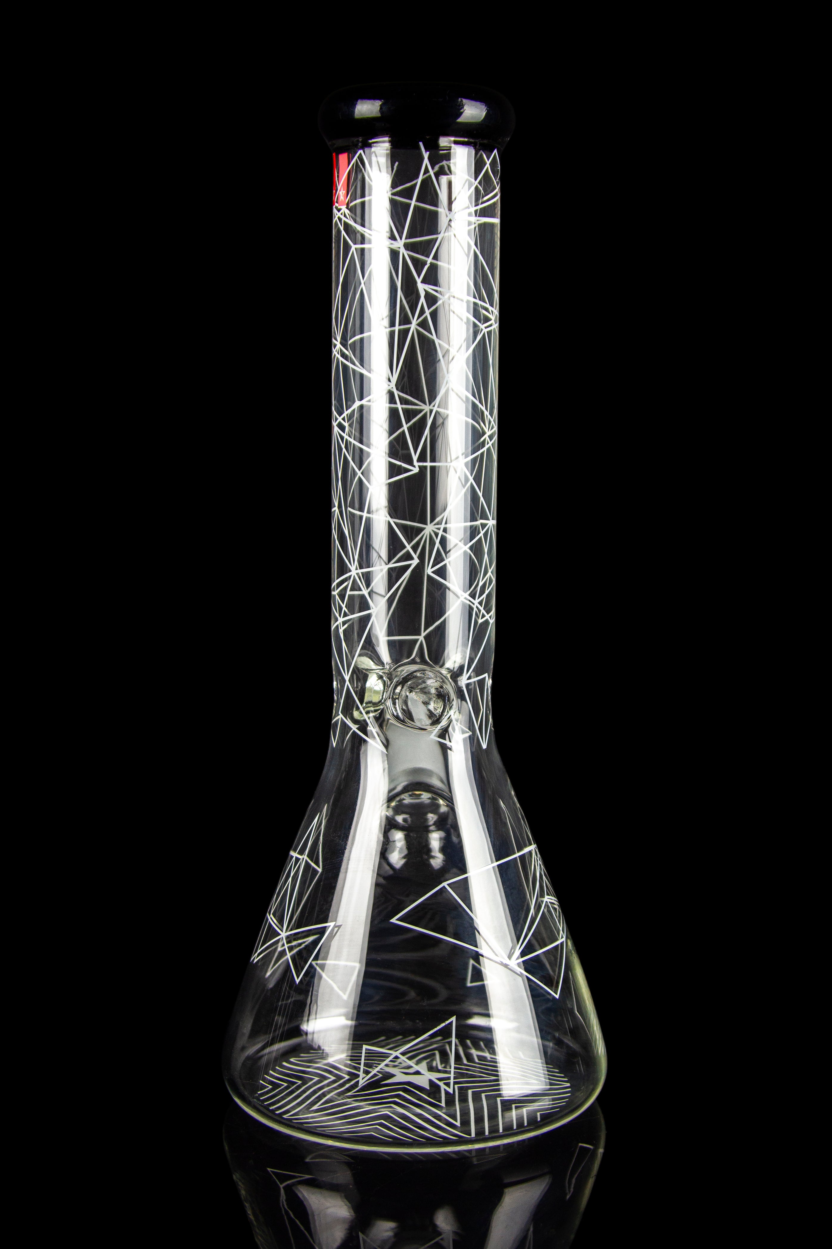 Close-up front view of the Famous Brandz Glass Beaker Ice Bong - Space showing white geometric line patterns on clear glass against a black background