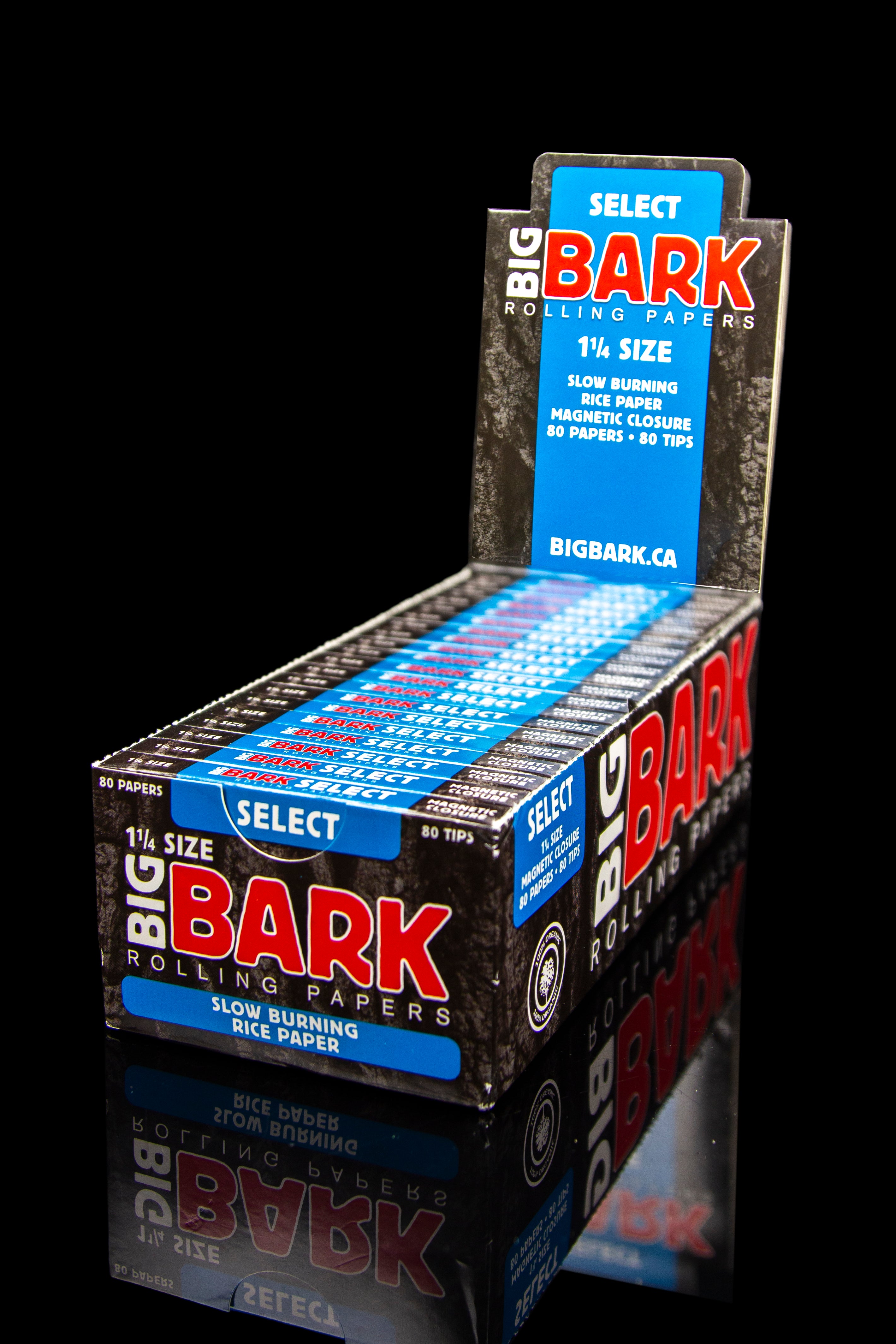 A display box of “Select Bark” 1 ¼ size slow-burning rice rolling papers and tips, with branding in blue, red, and white.