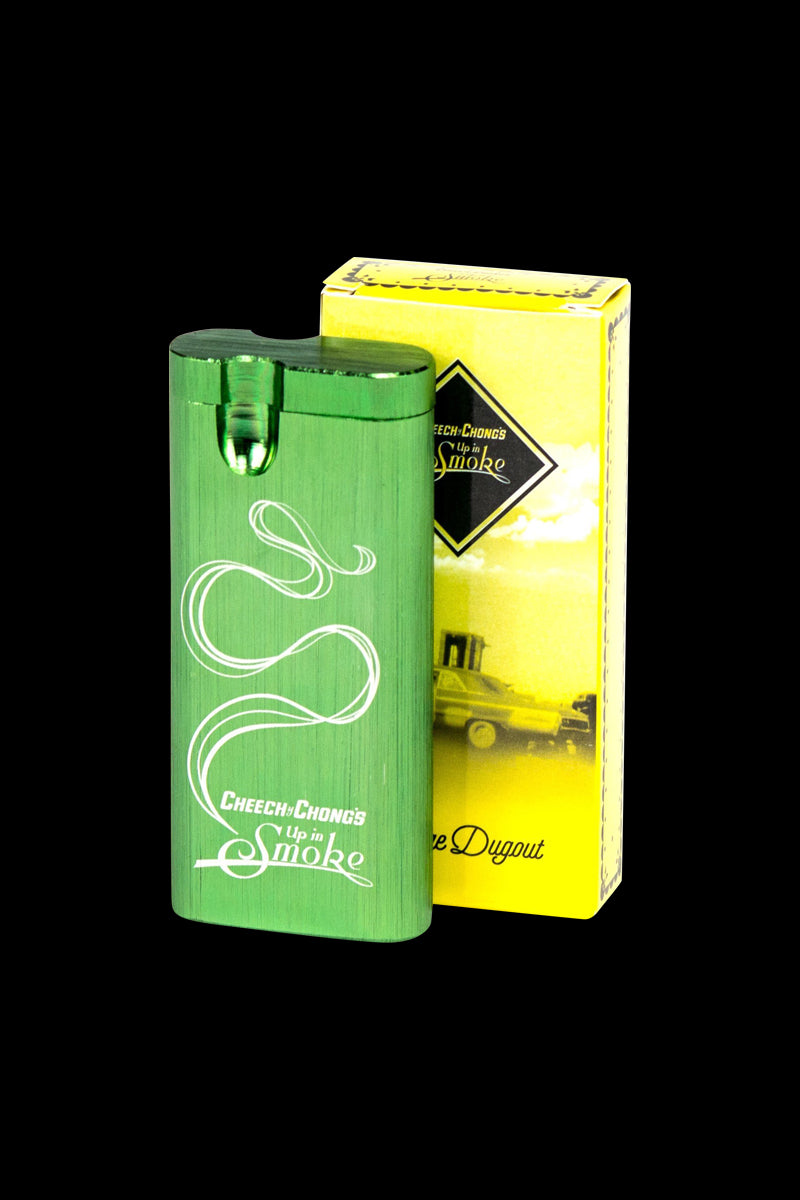 Front three-quarter view of the green Cheech & Chong Dugout - Up in Smoke standing against its yellow branded box on a black background.