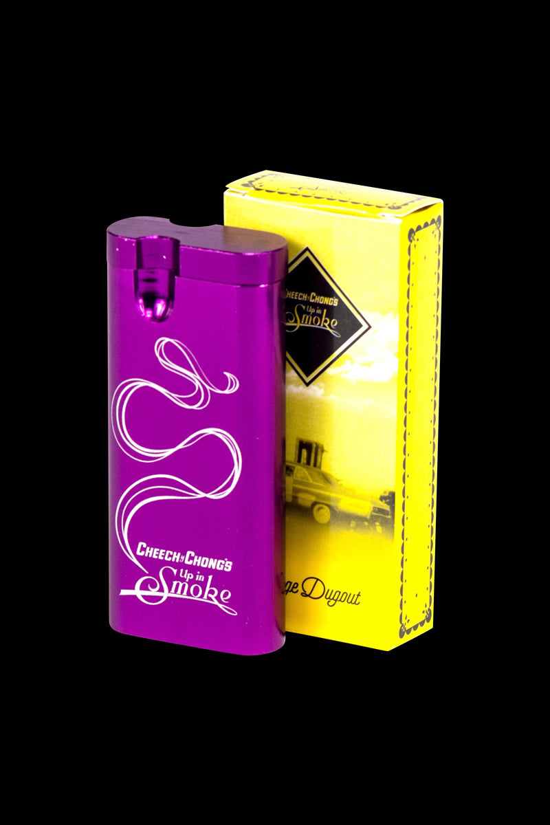 Three-quarter view of the purple Cheech & Chong Dugout - Up in Smoke standing beside its yellow branded box on a black background