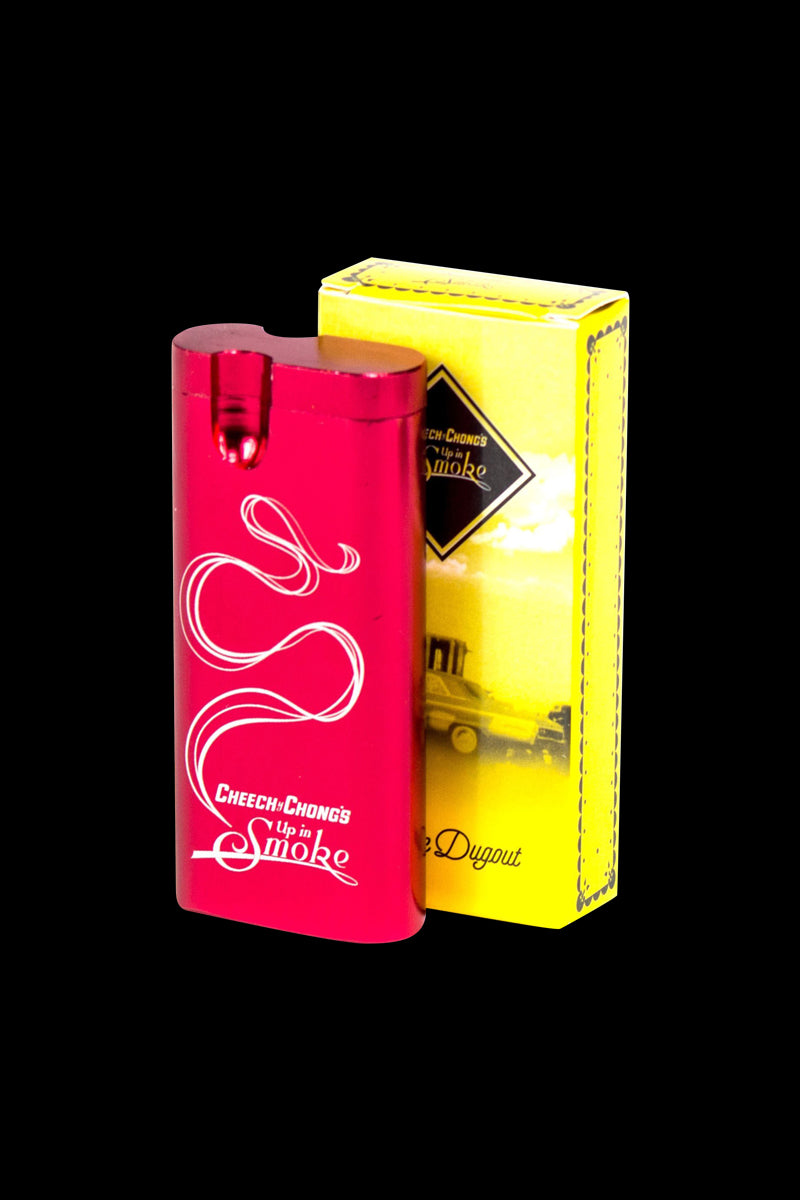 Front three-quarter view of a metallic green Cheech & Chong Dugout - Up in Smoke standing beside its yellow branded box on a black background