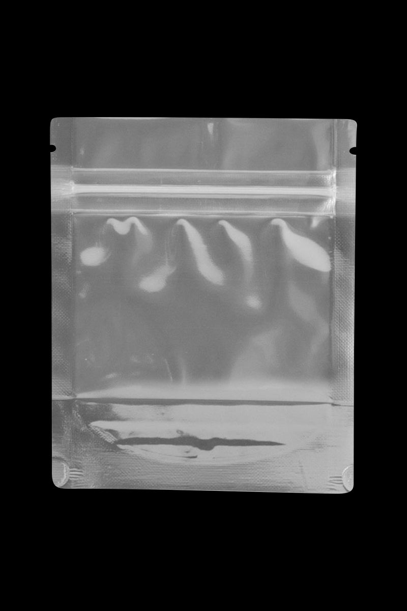 Front-facing shot of a clear Cannaline Smell Proof Bags small resealable pouch against a black background.