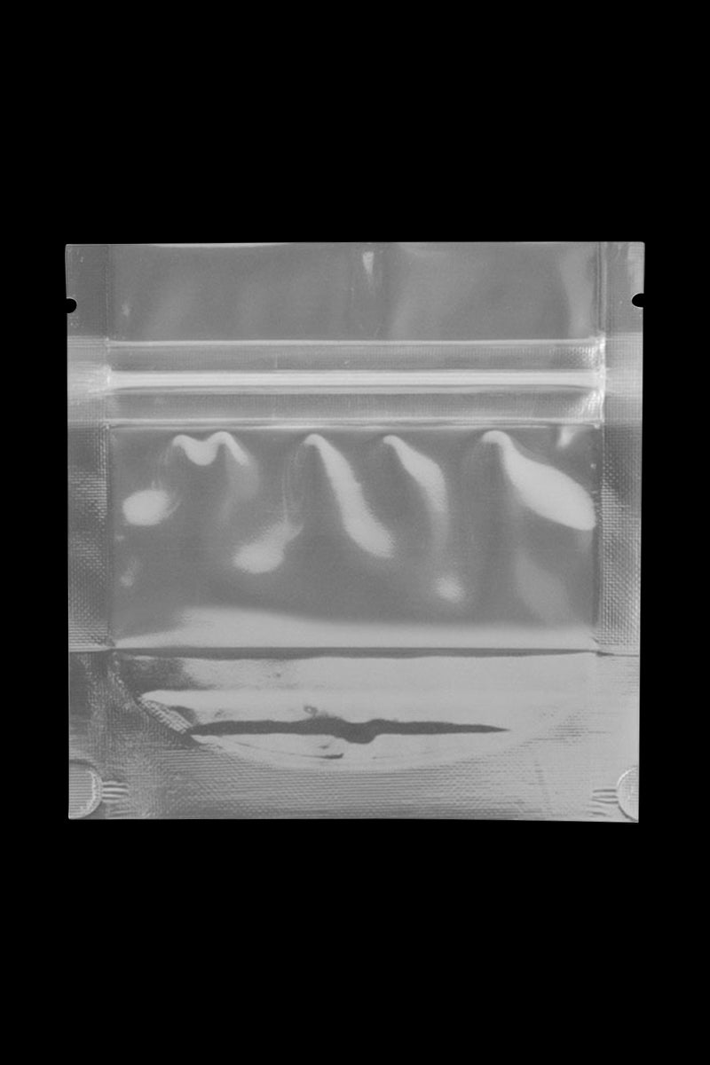 Centered front view of a clear pouch on black background showing the resealable top and textured edges of the Cannaline Smell Proof Bags.