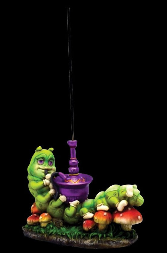 Incense Burner - Smoking Caterpillar depicts a sculpted, green caterpillar with a detailed, patterned body as it serves as a base for burning incense.