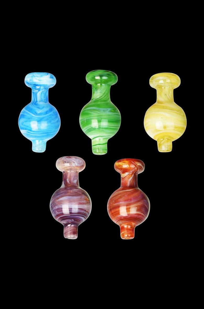 Top-down view of five colorful Cloudy Swirl Ball Carb Cap pieces arranged in two rows against a black background.