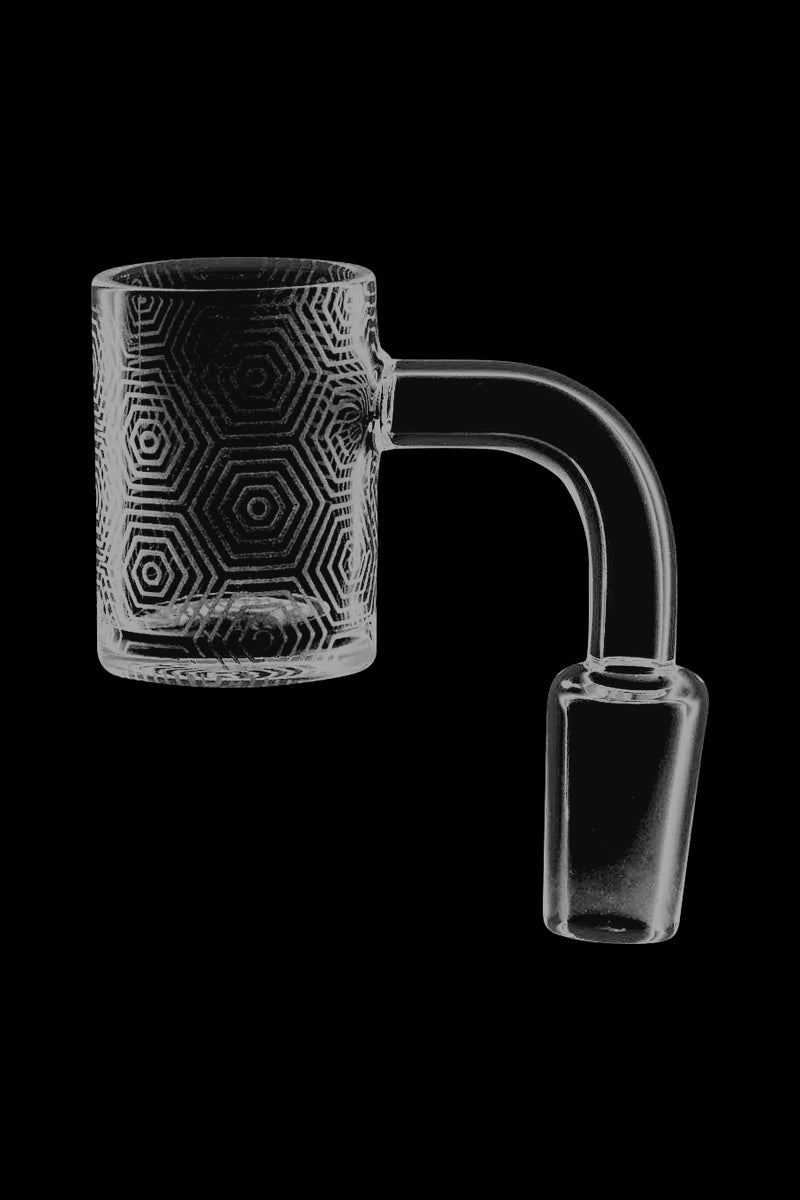 A close-up, angled view of the Concentric Hexagons Etched Quartz Banger, showing its clear quartz construction and etched hexagonal pattern.