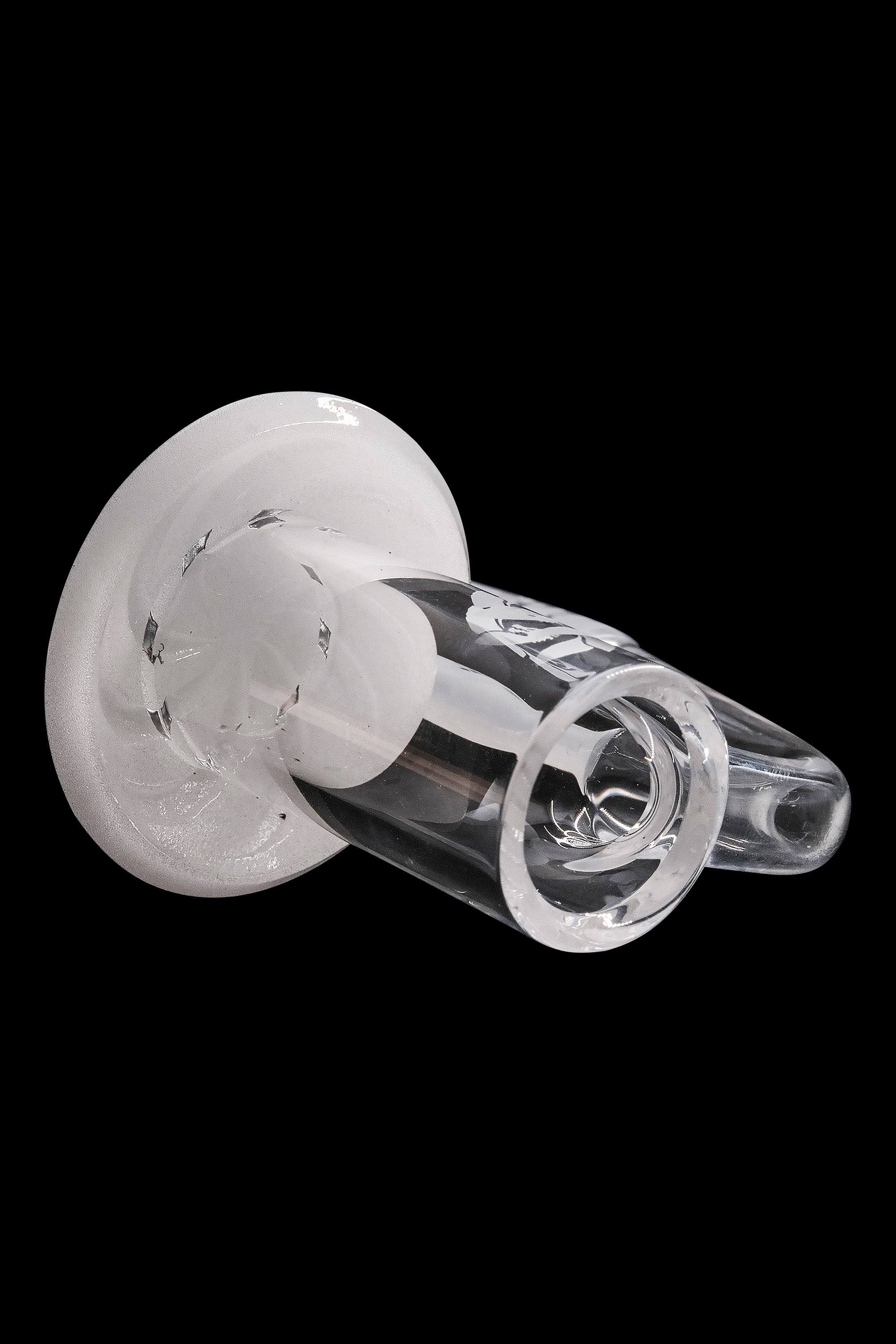 Clear glass cannabis bubbler with intricate swirling patterns.