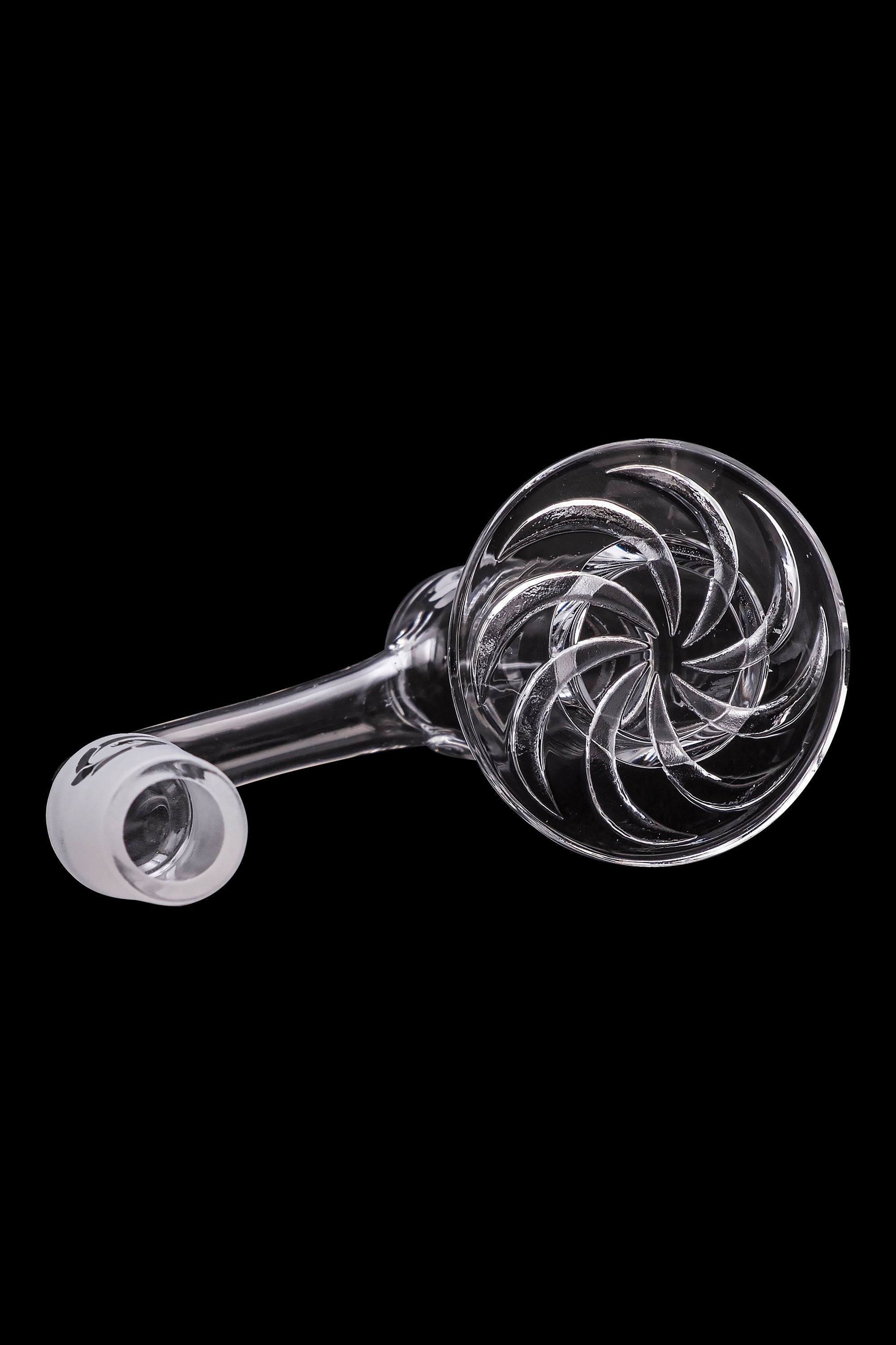 Clear glass pipe with intricate swirling design, isolated on black.