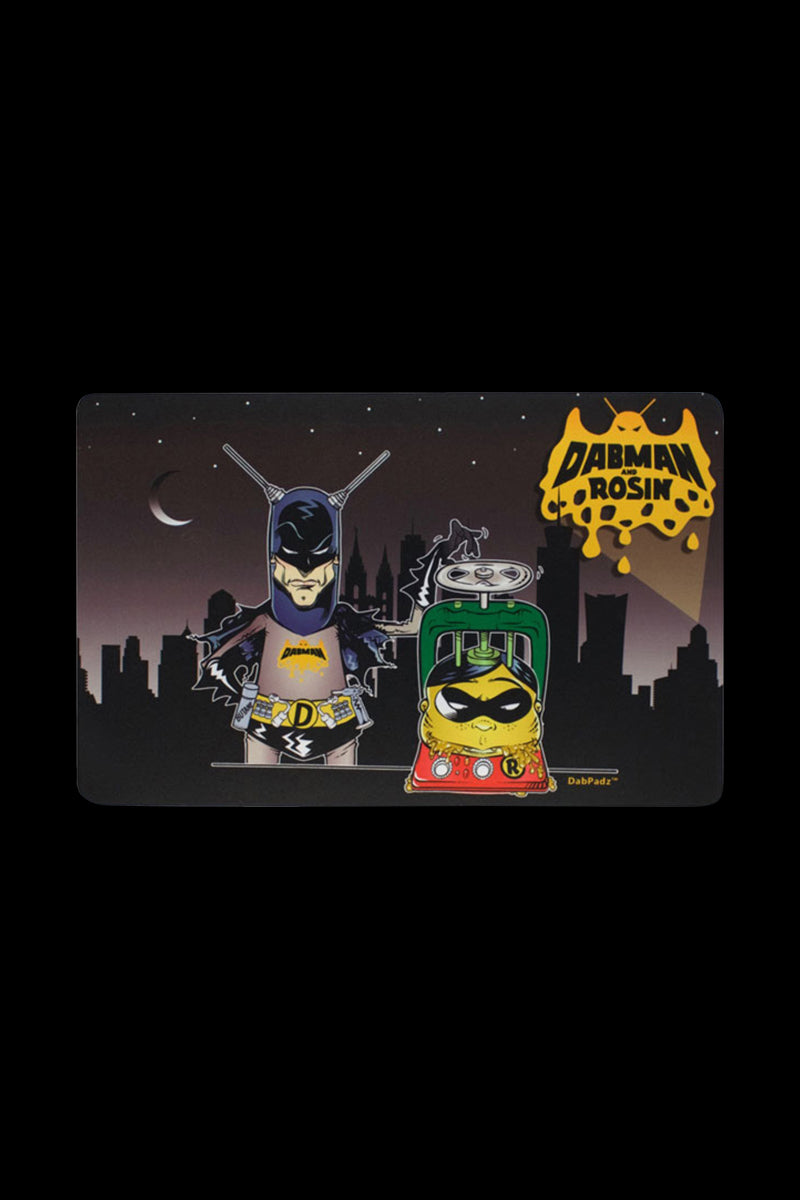 The DabPadz "Dabman & Rosin" Dab Mat is shown as a close-up, vibrant design with cartoon characters on a dark background.