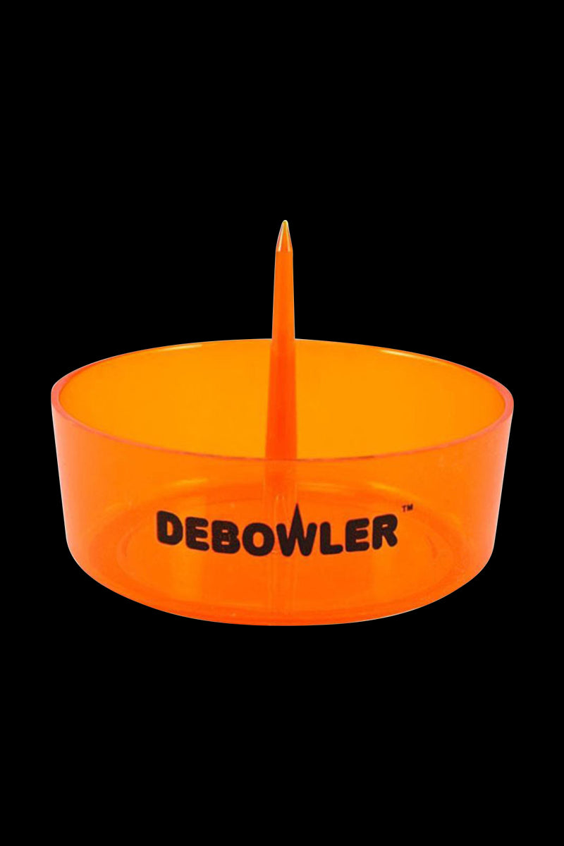 Front-facing view of the bright orange Debowler Ashtray with its central spike and bold logo visible against a black background