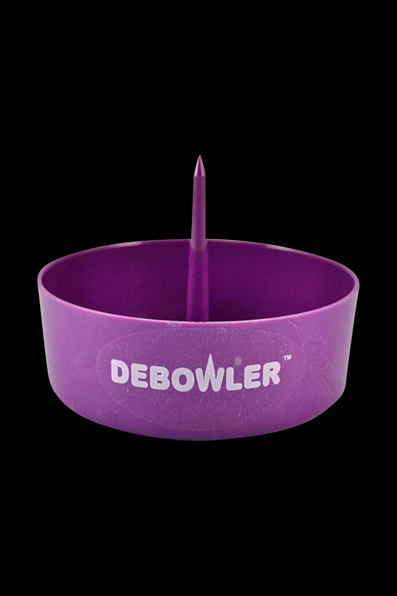 Front-facing view of the purple Debowler Ashtray showing its round bowl and central spike against a black background.