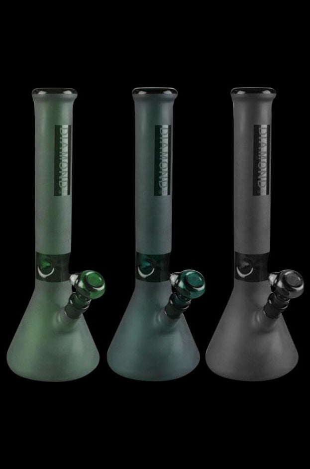A front view of the Diamond Glass Beaker Water Pipe, showcasing the clear glass construction and simple beaker shape against a dark background.