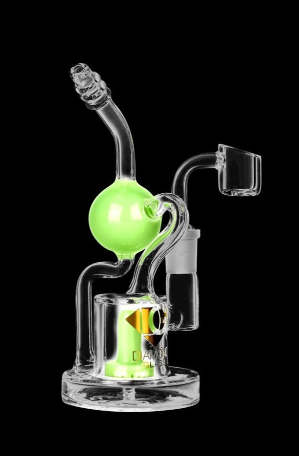 A studio shot of the Diamond Glass Buoy Recycler Rig, showing the clear glass recycler with a rounded base and angled mouthpiece.