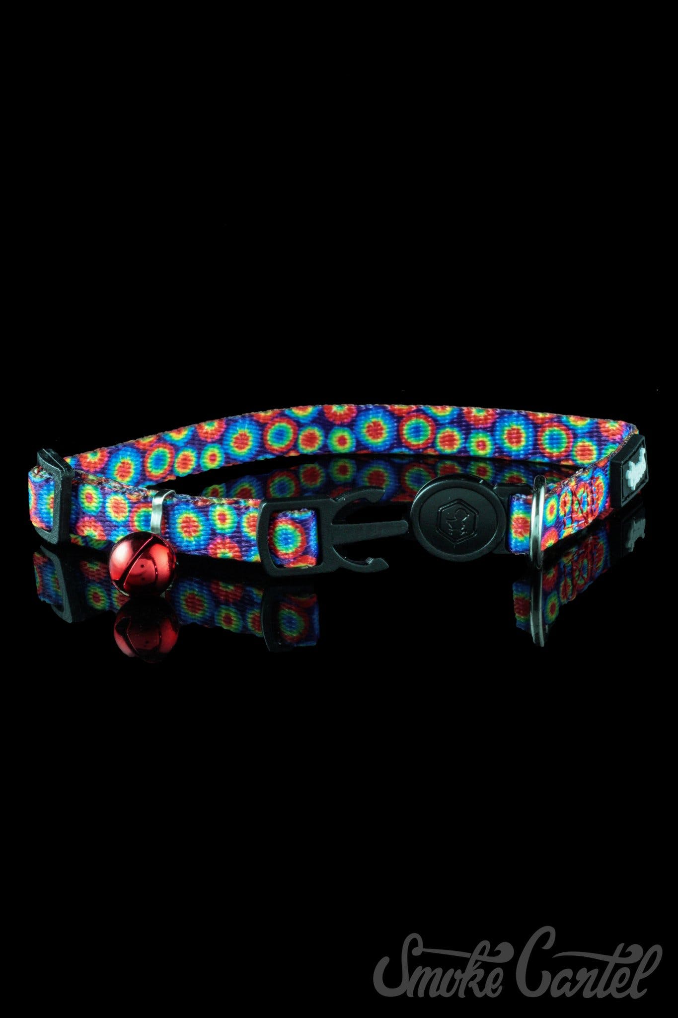 A close-up shot of the HeadyPet Cat Collar, displaying a colorful pattern against a dark background.